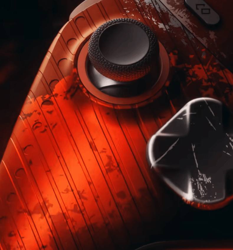 Offizielles Detailfoto des Collab-Controllers: vertikale Riffelung am roten Griffbereich und kratzartige weiße Markierungen über dem D-Pad