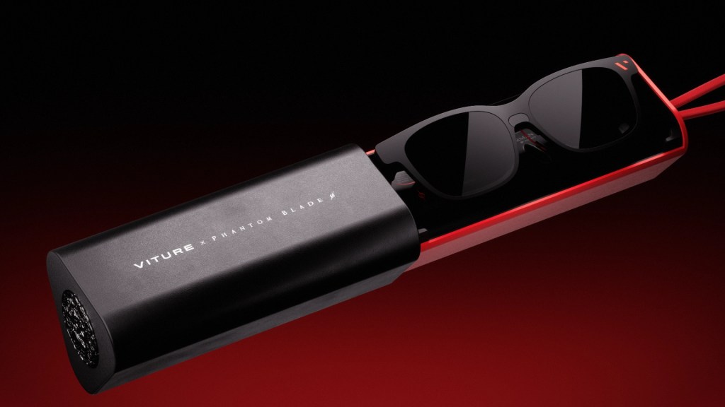 Official promotional image: the Phantom Beast XR glasses resting in their red-and-black triangular case with VITURE x PHANTOM BLADE branding
